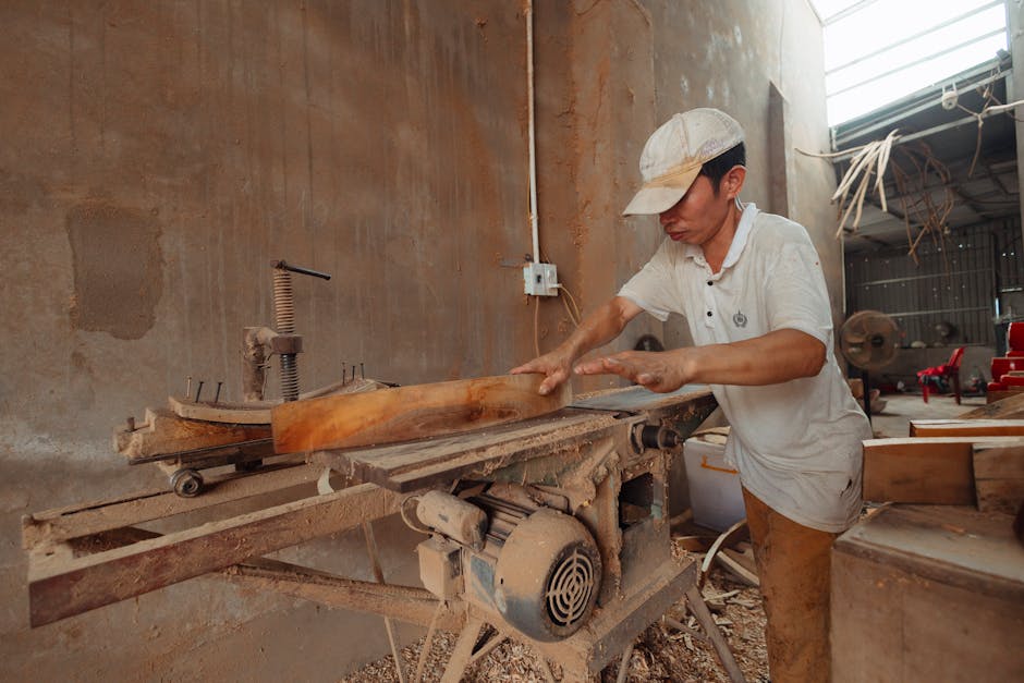 Master woodworker crafting bespoke furniture in workshop